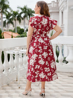 Load image into Gallery viewer, Plus Size Floral Tie Waist Surplice Neck Midi Dress
