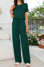 Load image into Gallery viewer, Round Neck Open Back Jumpsuit with Pockets
